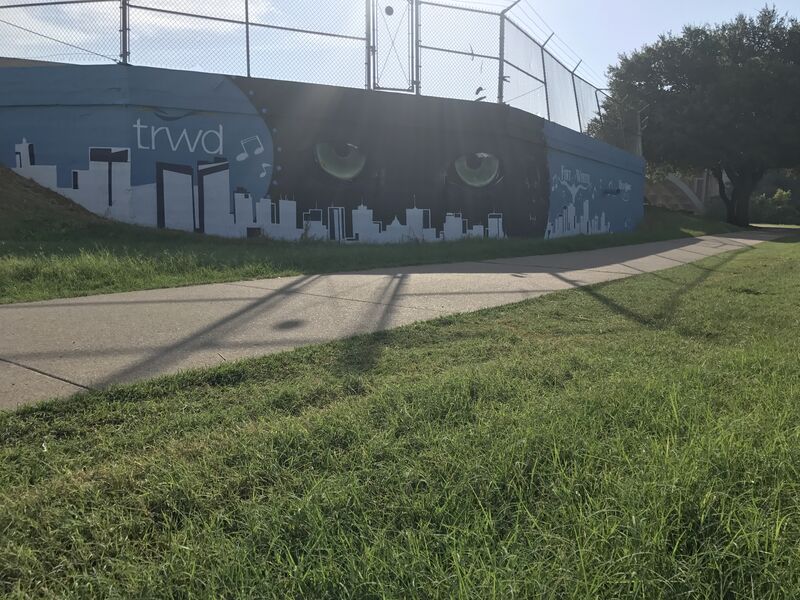 The TRWD mural on the Trinity Trails, the Fort Worth skyline painted along the wall.
