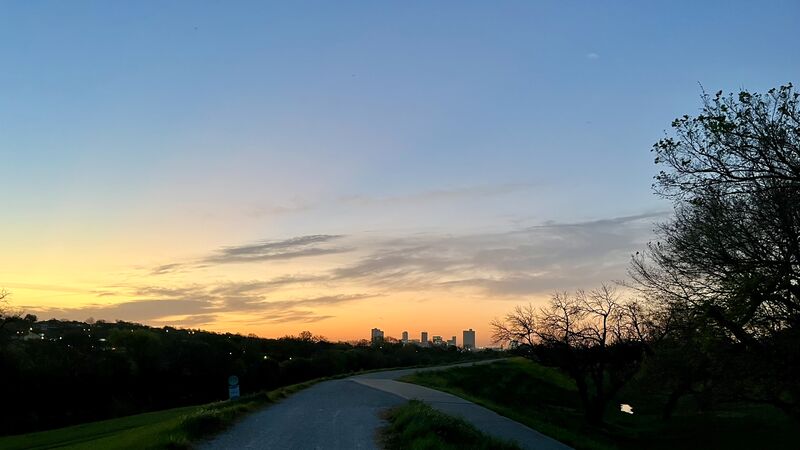 The Trinity Trails at dawn, the path running toward the downtown Fort Worth skyline.