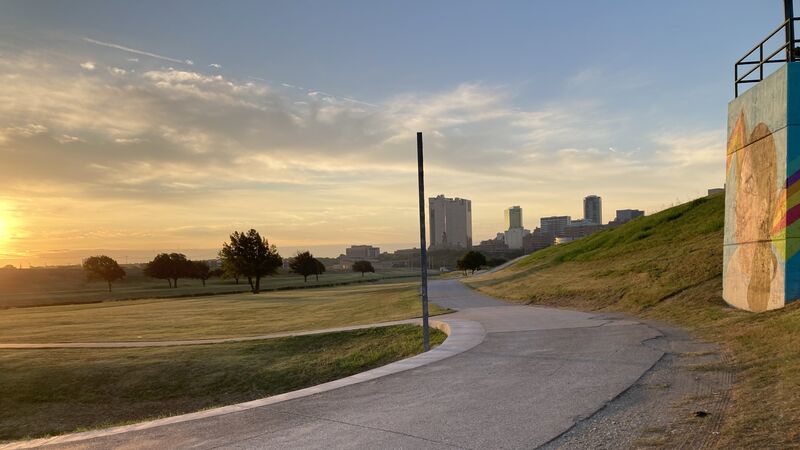 The West Fork trail curving toward downtown Fort Worth in early light.